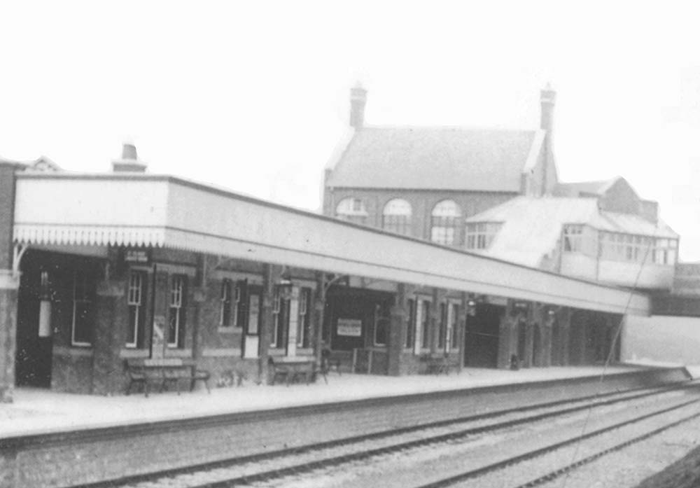 Close up showing the glazed covered walkway providing access from the booking hall down to the platform
