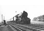 LNER 4-6-0 Class B17/4 No 2847 'Helmingham Hall' passes over Staverton Road on a down express service