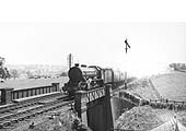 LNER 4-6-0 Class B17/4 No 2848 'Arsenal' roars across Staverton Road on a down express in June 1939