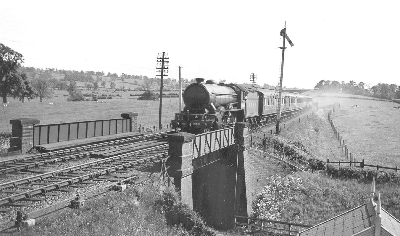 LNER 4-6-0 Class B17/4 No 2855 'Middlesborough' crosses Staverton Road at speed on a down express in June 1939