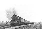 LNER 4-6-0 Class B17/4 No 2862 'Manchester United' is seen working hard at the head of a down express train