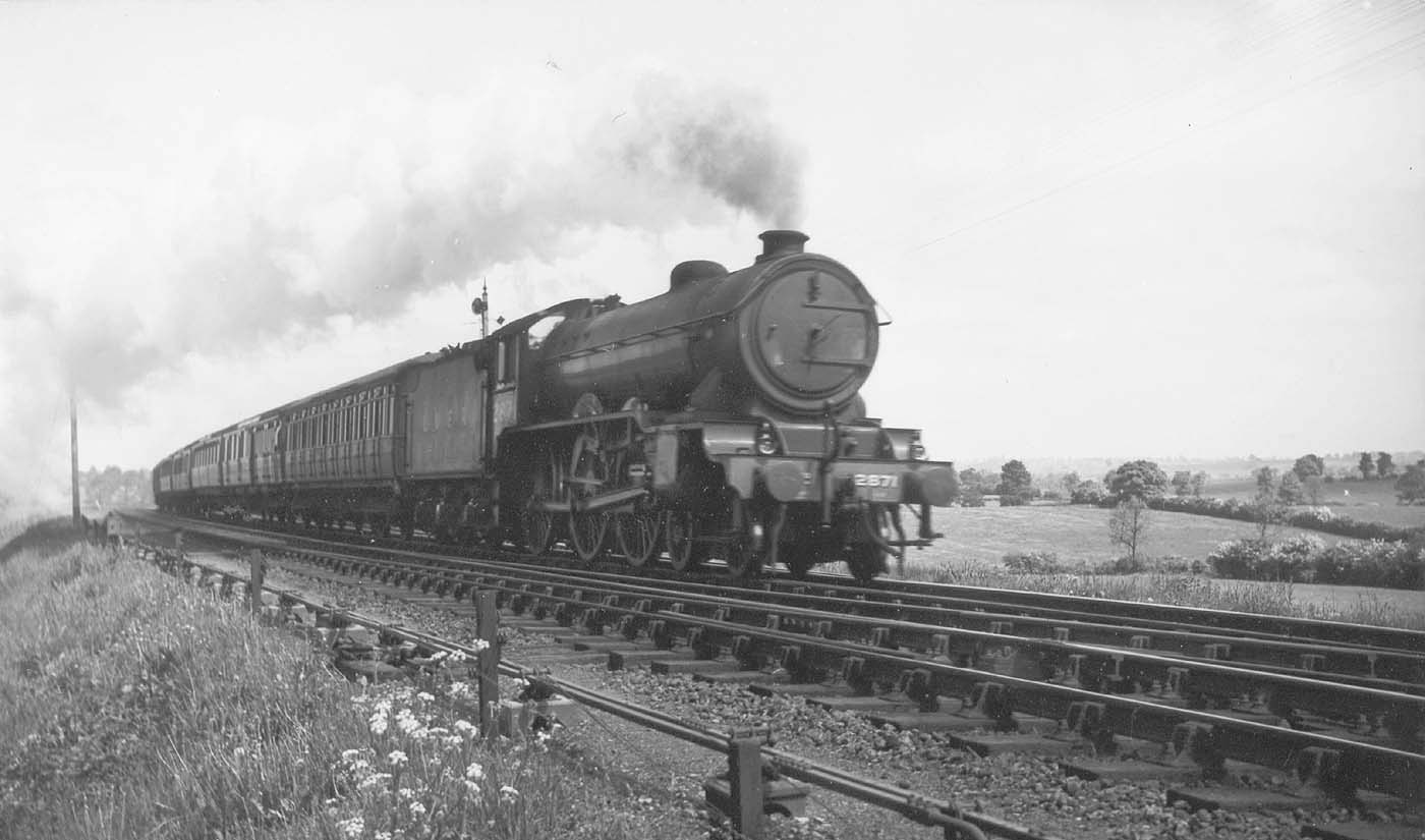 LNER 4-6-0 Class B17/4 No 2871 'Manchester City' races along at the head of a down express service circa 1946