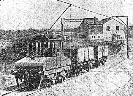 View of the Power Station's overhead electric locomotive in front of the power station in its initial form