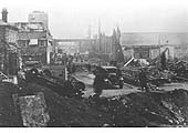 A view from the main gate showing the damage at the BSA works after a major air raid in the Second World War