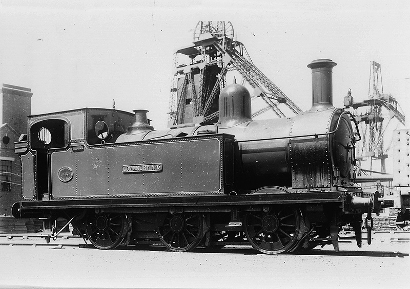 Ex-Barry Railway Class A 0-6-0 'Coventry No 5' is seen fresh out of the shops standing next to Coventry Colliery's main shaft