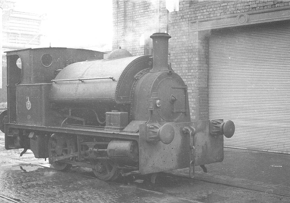 Another of Coventry Gas Works' 0-4-0ST Bagnall locomotive stands in steam alongside one of the workshops