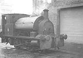 Another of Coventry Gas Works' 0-4-0ST Bagnall locomotive stands in steam alongside one of the workshops