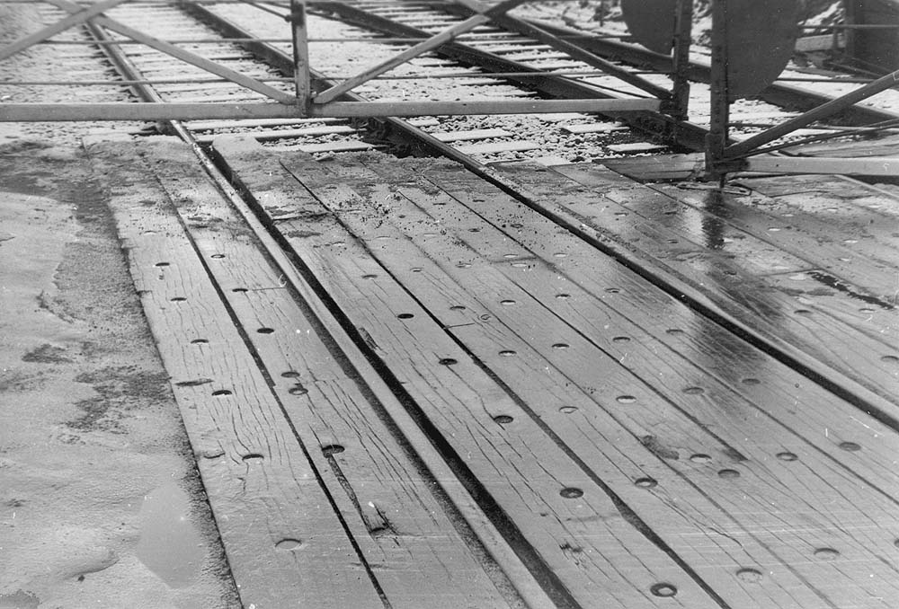 Close up showing the method of securing crossing timbers for road vehicles at Bedlam Lane crossing during the Winter of 1971