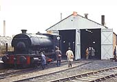 The 'Foleshill Railway Company' flag flutters above railway enthusiasts inspecting the locomotive shed