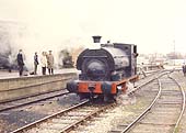 Railway enthusiasts on a platform watch Peckett 0-4-ST, Works No 1722, 'Rocket', steam by on 8th April 1972