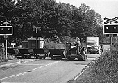 Motor Rail 40SD501 is seen crossing Water Orton Lane at the head of empty skips at Minworth Sewage Works