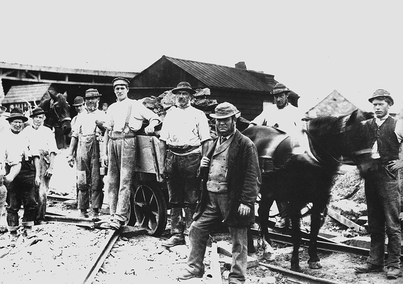 A gang of men and horse-drawn wagon pose at Rugby Cement's New Bilton Cement Works circa 1900