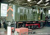 Army 402, an 0-4-0 Diesel Hydraulic locomotive, is seen under repair inside the well kept locomotive shed