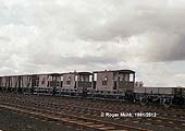 Newly overhauled internal rolling stock in the marshalling yard awaiting transfer over BR tracks to a Naval Depot