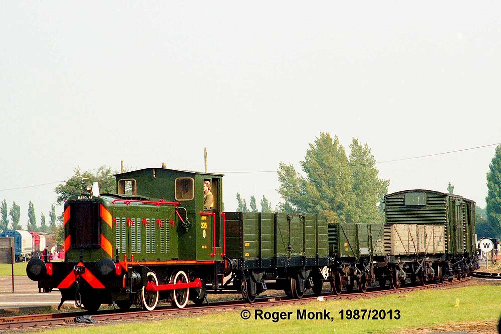 'Veteran' diesel 235 Andrew Barclay 371 of 1945 hauls a train of traditional freight wagons. The first wagon is an ex USA Army TC WWII vehicle.