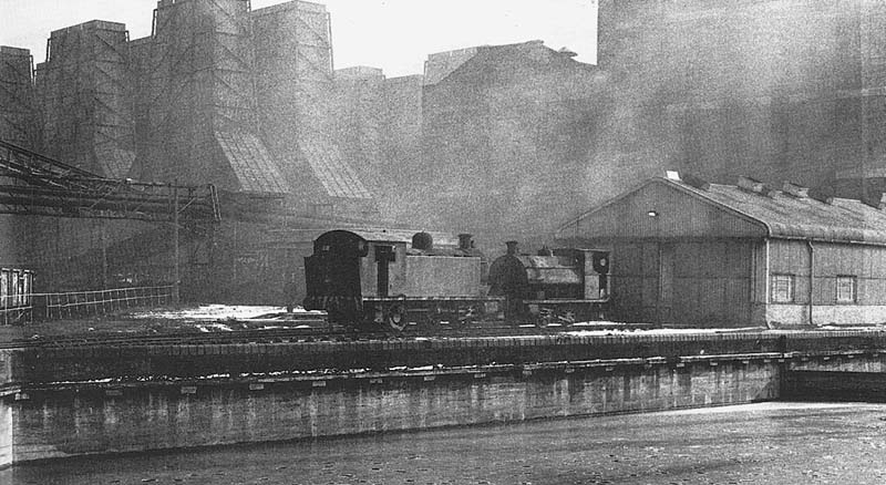 Robert Stephenson & Hawthorn 0-6-0T and Peckett 0-4-0ST locomotives stand head to head outside the 'new' locomotive shed