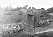 The second of a set of five photos of a rake of derailed loose coupled Newdigate Colliery wagons lying in Coventry Canal