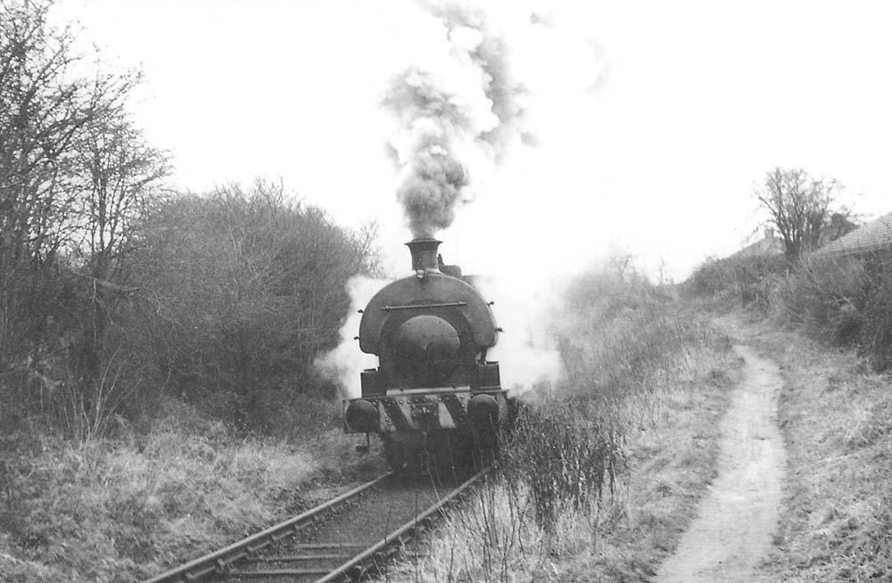Newdigate Colliery's 0-6-0ST No 4 has just emerged from beneath the Coventry to Nuneaton Road bridge on its way back to the Colliery