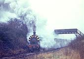 One of Newdigate Colliery's Peckett blasts away from the exchange sidings with a train of empties in the 1960s