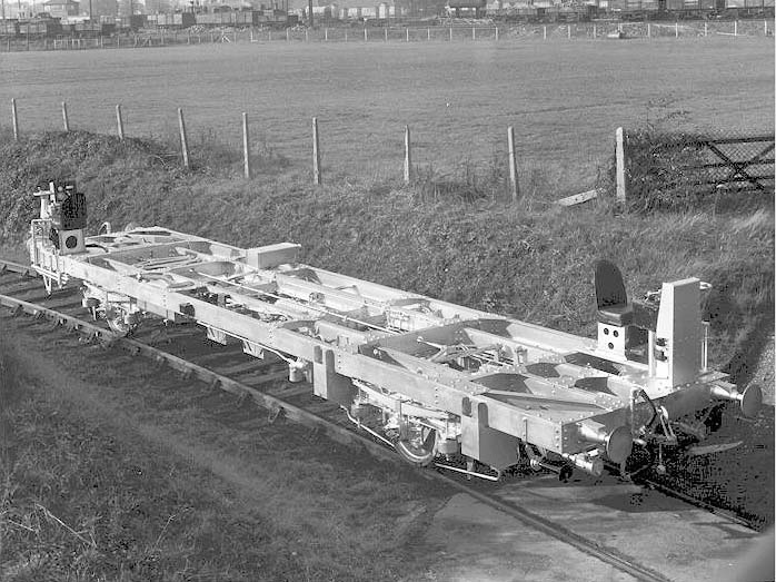 A three-quarters elevated view of the BTU Motor Brake Third Railcar's chassis outside of the works