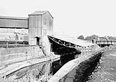 View of Southam Cement Works' loading dock on the Grand Union Canal for shipping cement as far as London